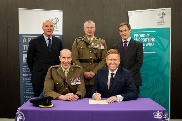 The Leader of Lichfield District Council, Councillor Doug Pullen signs the Armed Forces Covenant.