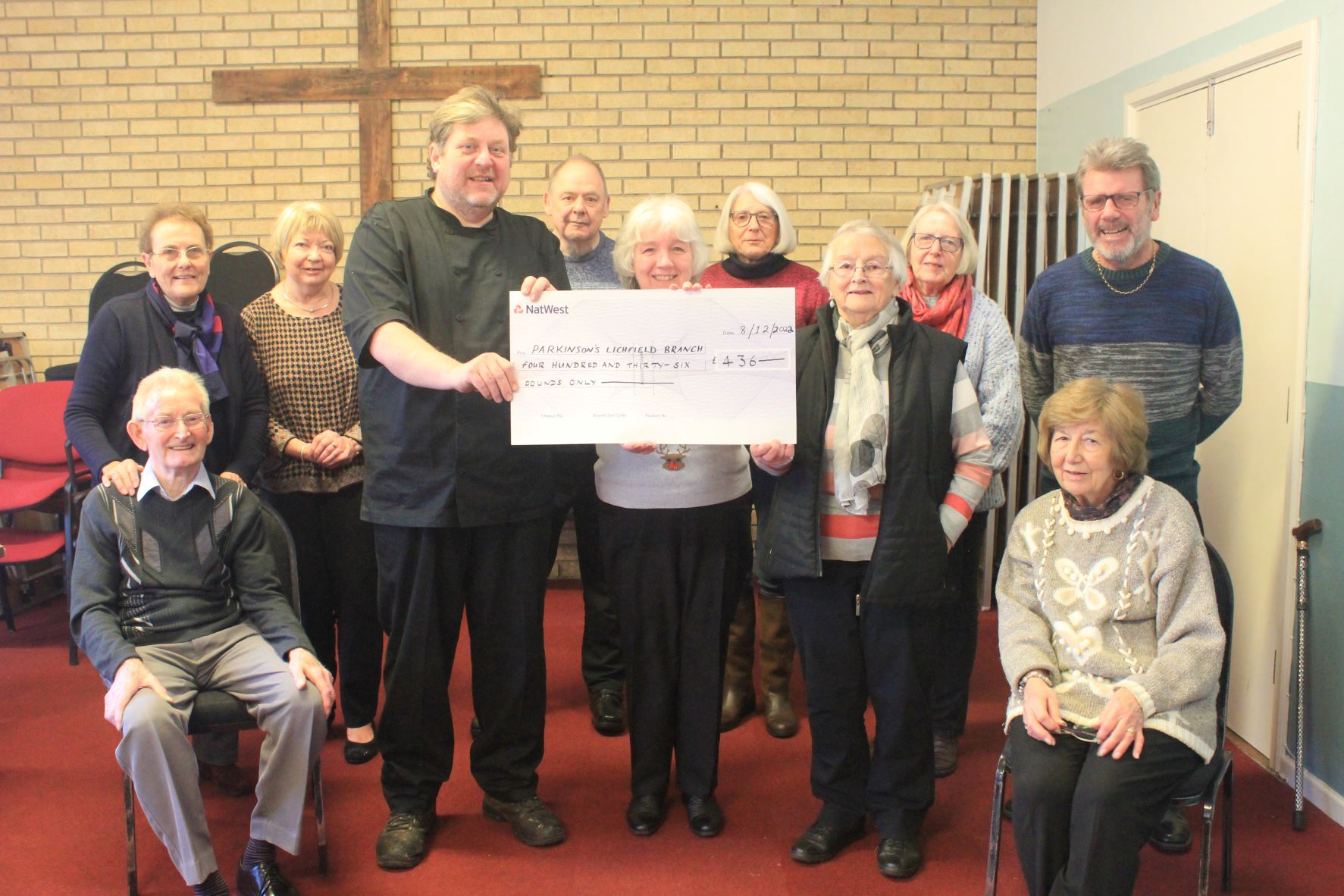 Barry Gwilt presents a cheque to members of Parkinson's UK Lichfield and District Branch.