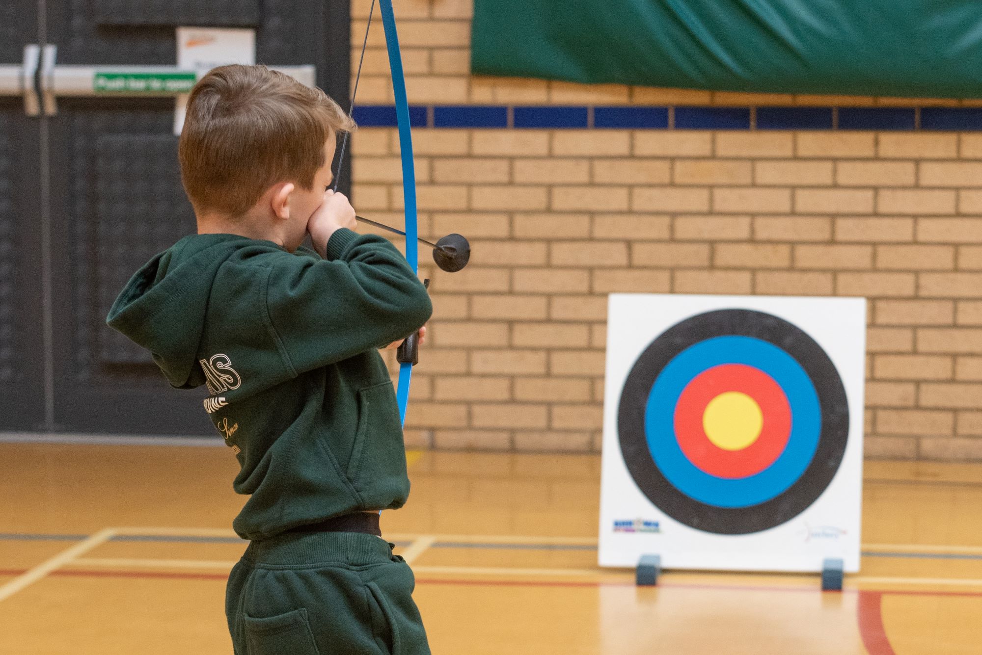 A picture of a youngster enjoying soft archery.