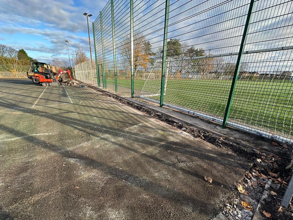 The picture shows refurbishment work taking place at the tennis courts.