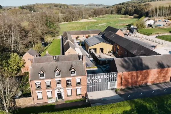 A picture of Blackbrook Barns wedding venue with installed solar panels.
