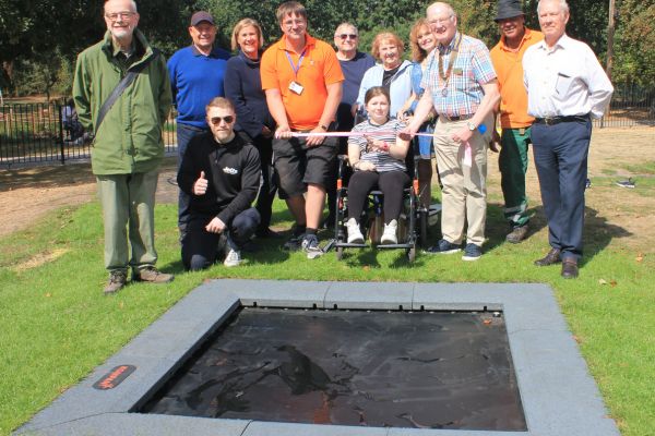 A picture of Grace Riley cutting the ribbon to open the new bouncer in Beacon Park.