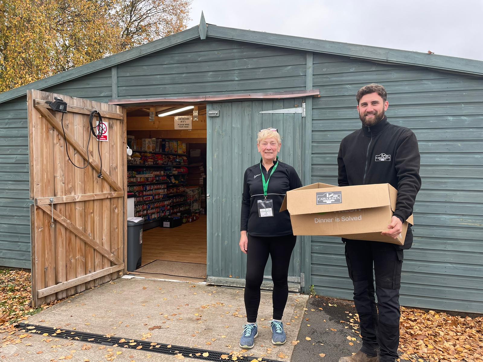 A picture of a donation by Cawarden to Lichfield Foodbank.