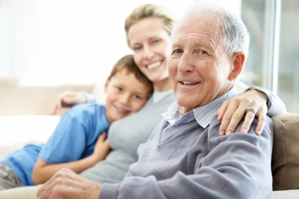 An elderly man with his family