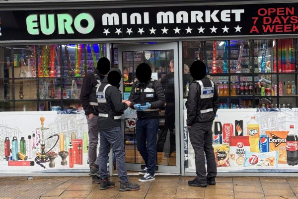 A picture of Lichfield District Council’s Environmental Health officers issuing a Closure Notice at the Euro Mini Market today.