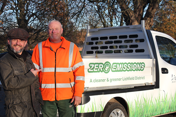 Cllr Yeates with street cleansing team leader in front of electric vehicle
