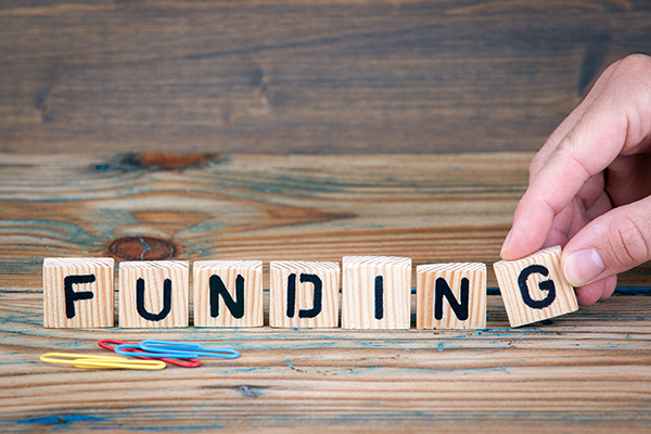 A photo of toy bricks to display the word &#039;funding&#039;.