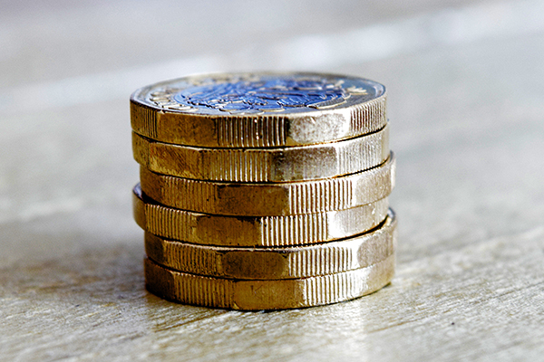 A photo of a small pile of pound coins.