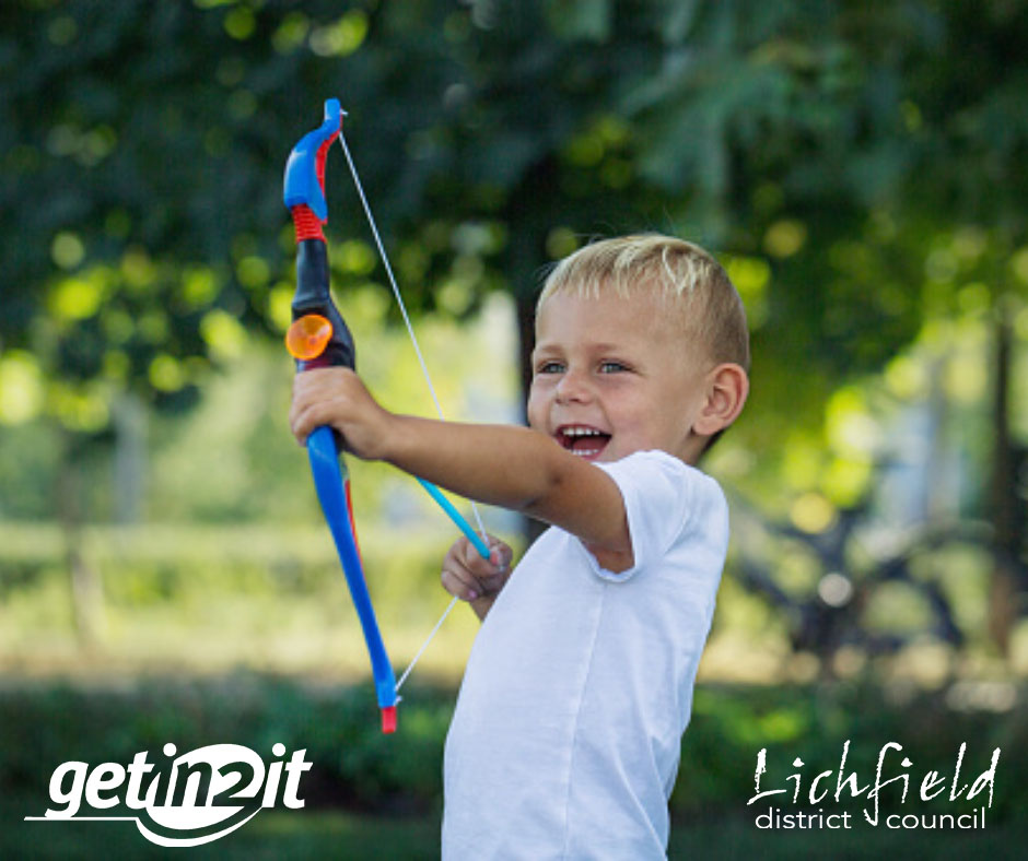A photo of a young boy enjoying soft archery.
