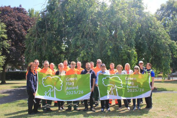 A picture of council staff and partners celebrating the Green Flag awards for Beacon Park and Burntwood Park.