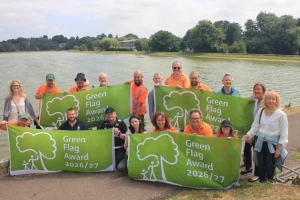 A picture of council staff and partners celebrating the Green Flag awards for Beacon Park and Burntwood Park.