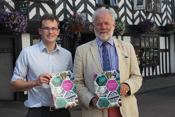 Jonathan Percival and Councillor Ian Pritchard holding investment prospectus