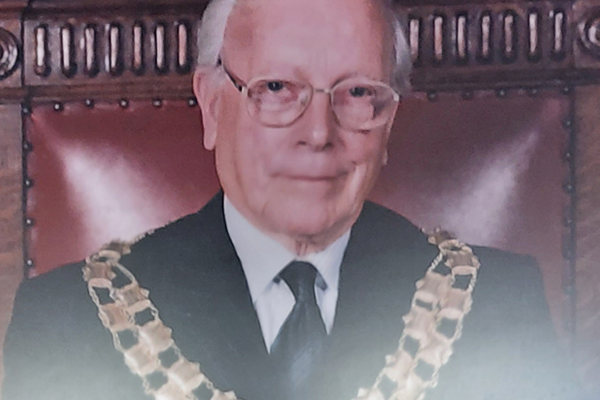 John Dickson with chairman's chains round neck