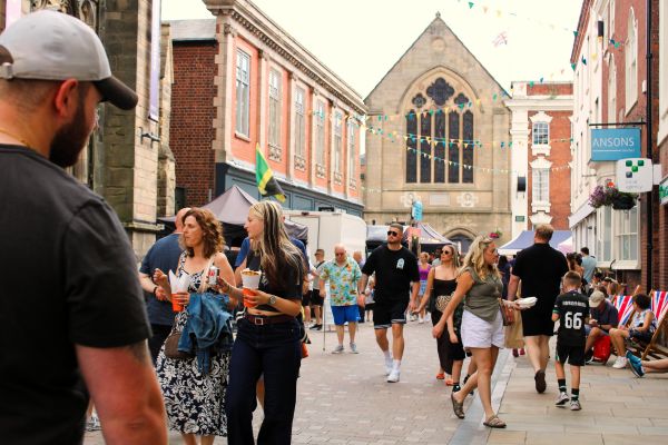 A picture of people enjoying last year’s Lichfield Food and Drink Festival in Breadmarket Street.