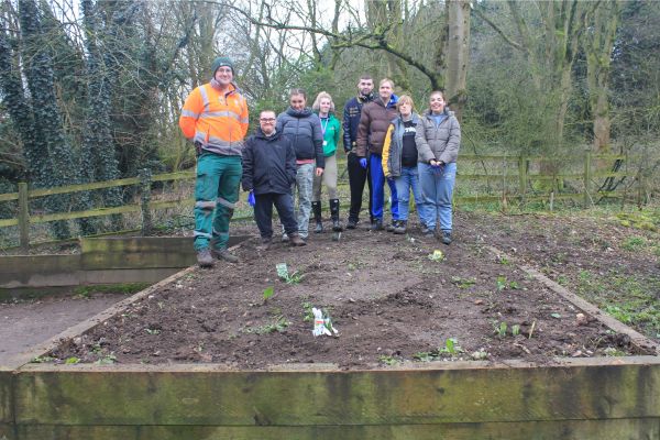 Members of Liberty Jamboree and James Myers of our Parks Team (left) with the planter at Christian Fields.