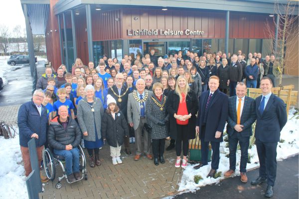 A picture of people celebrating the official opening of Lichfield Leisure Centre.
