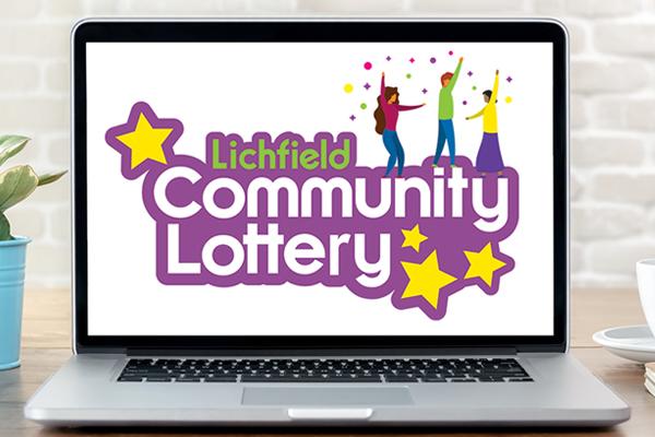 computer with Lichfield Community Lottery logo on screen