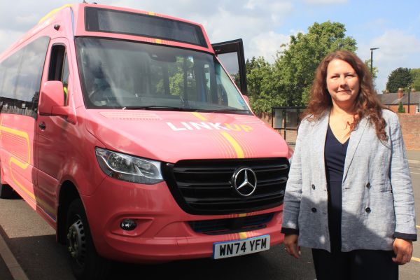 A picture of Councillor Janice Silvester-Hall, Cabinet Member for Economy, Ecology and Climate Change with the LinkUp bus.