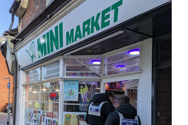 A picture of officers carrying out the enforcement operation at Mini Market, St John Street, Lichfield.