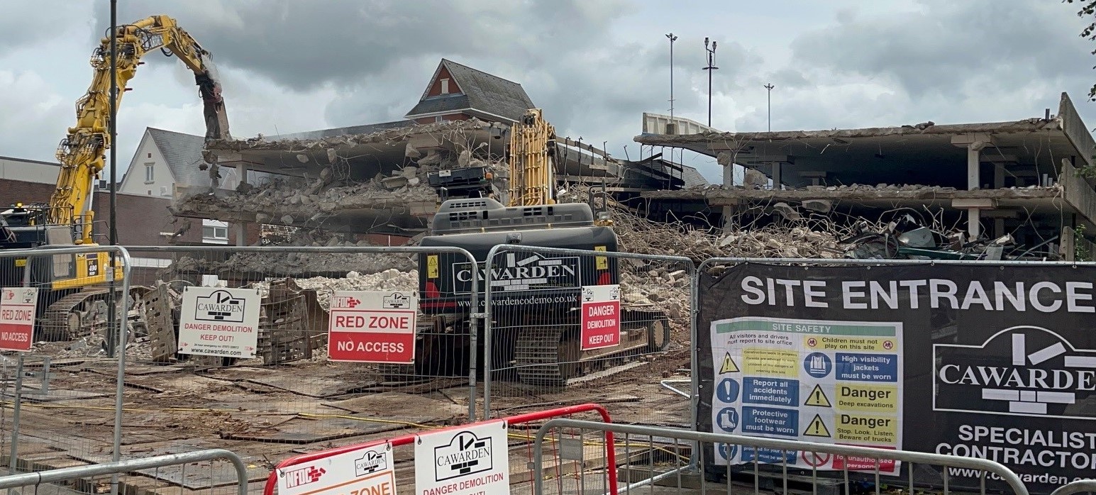 A picture of the demolition of the multi storey car park in progress last July.
