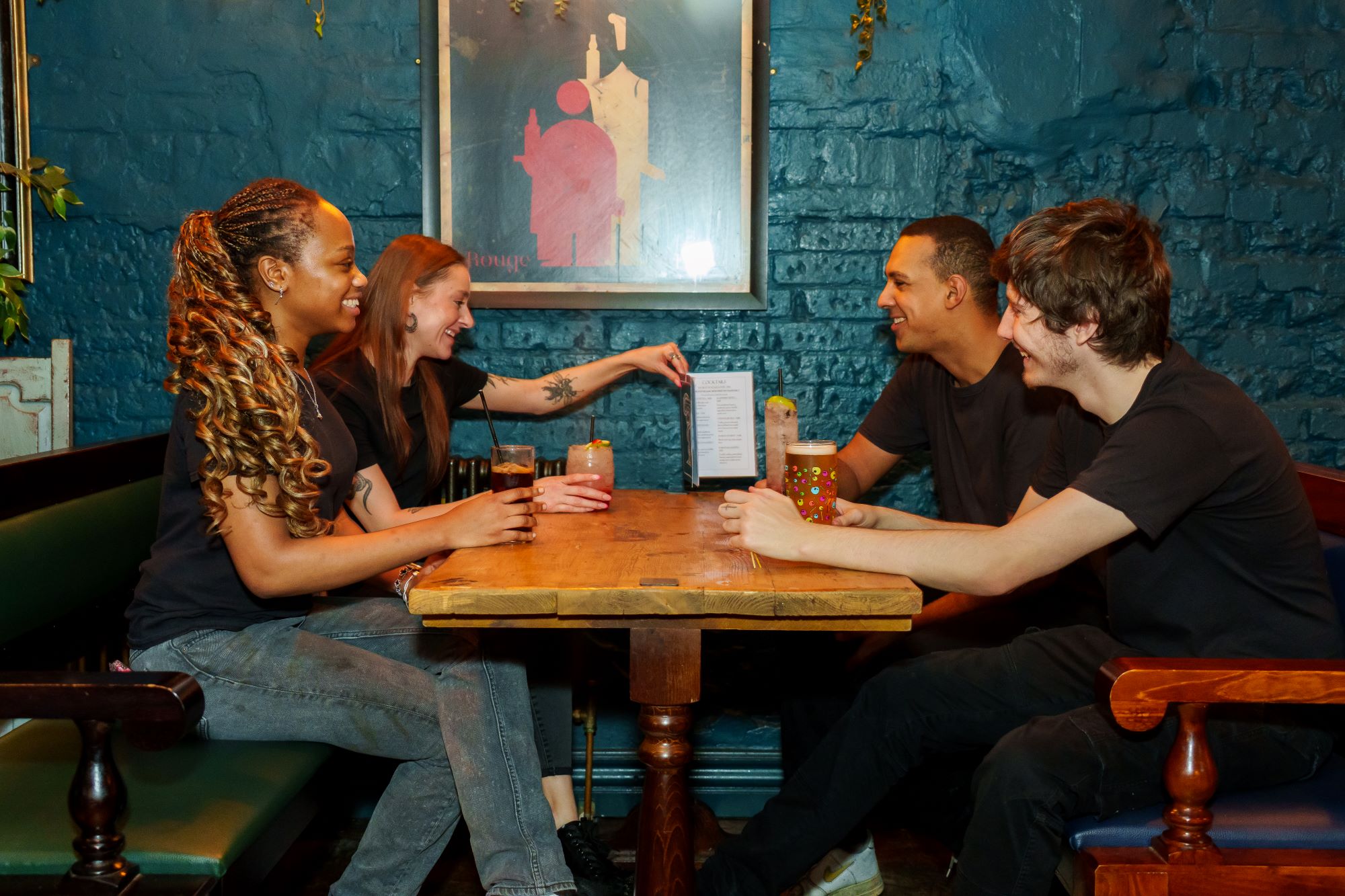 A picture of people enjoying a drink.