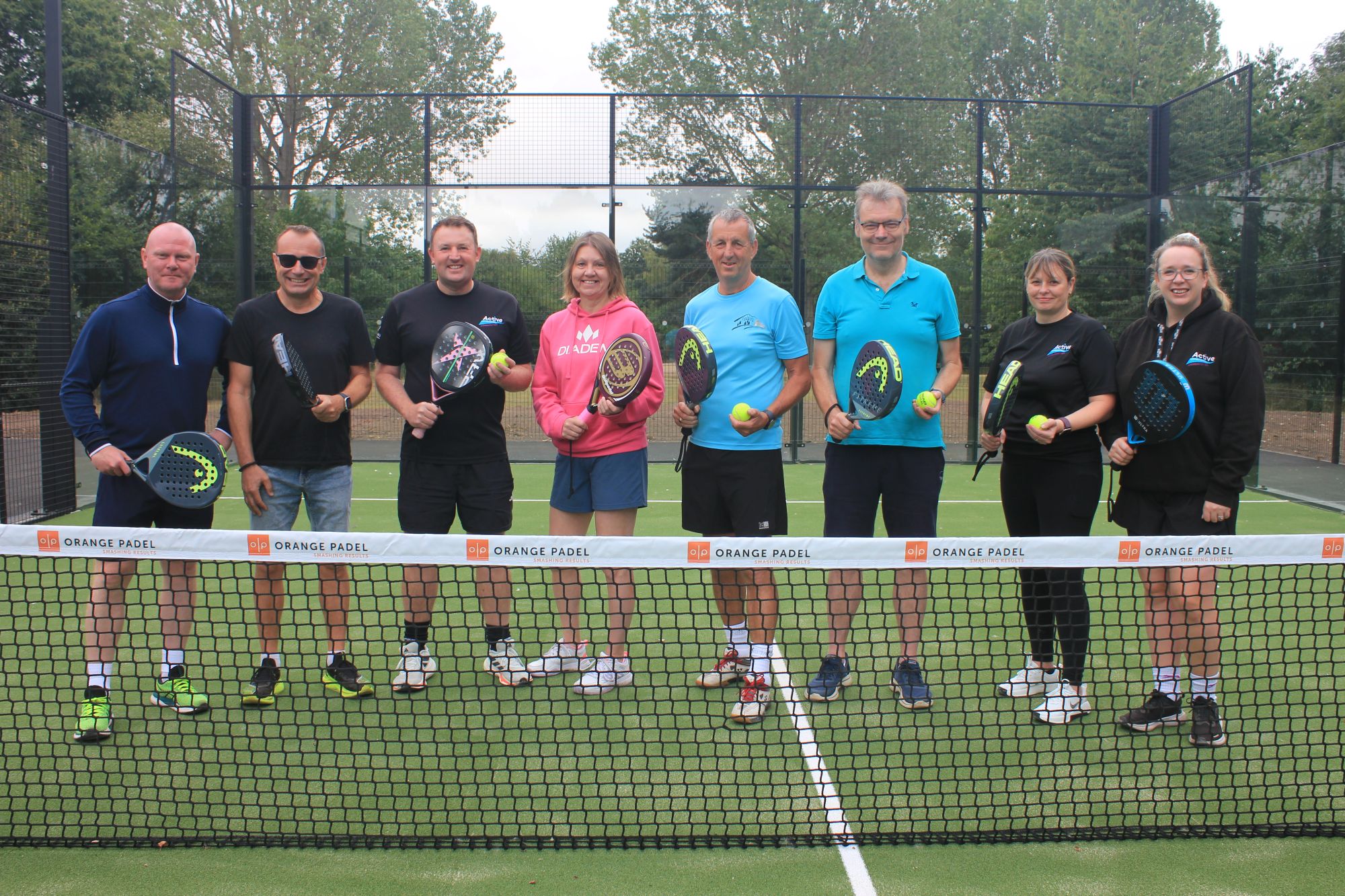 A picture of council staff Celebrating the opening of the new Padel courts in Beacon Park.
