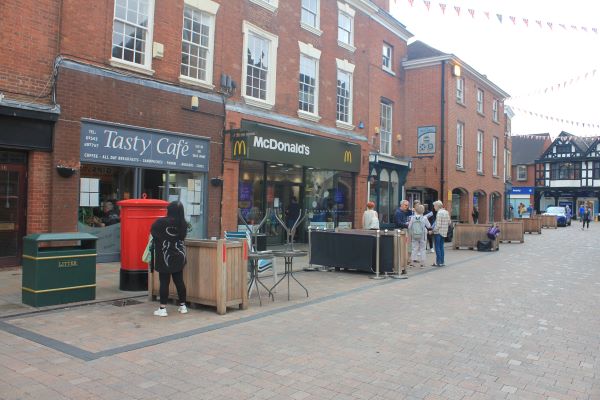 Pavement cafes operate in Lichfield city centre.