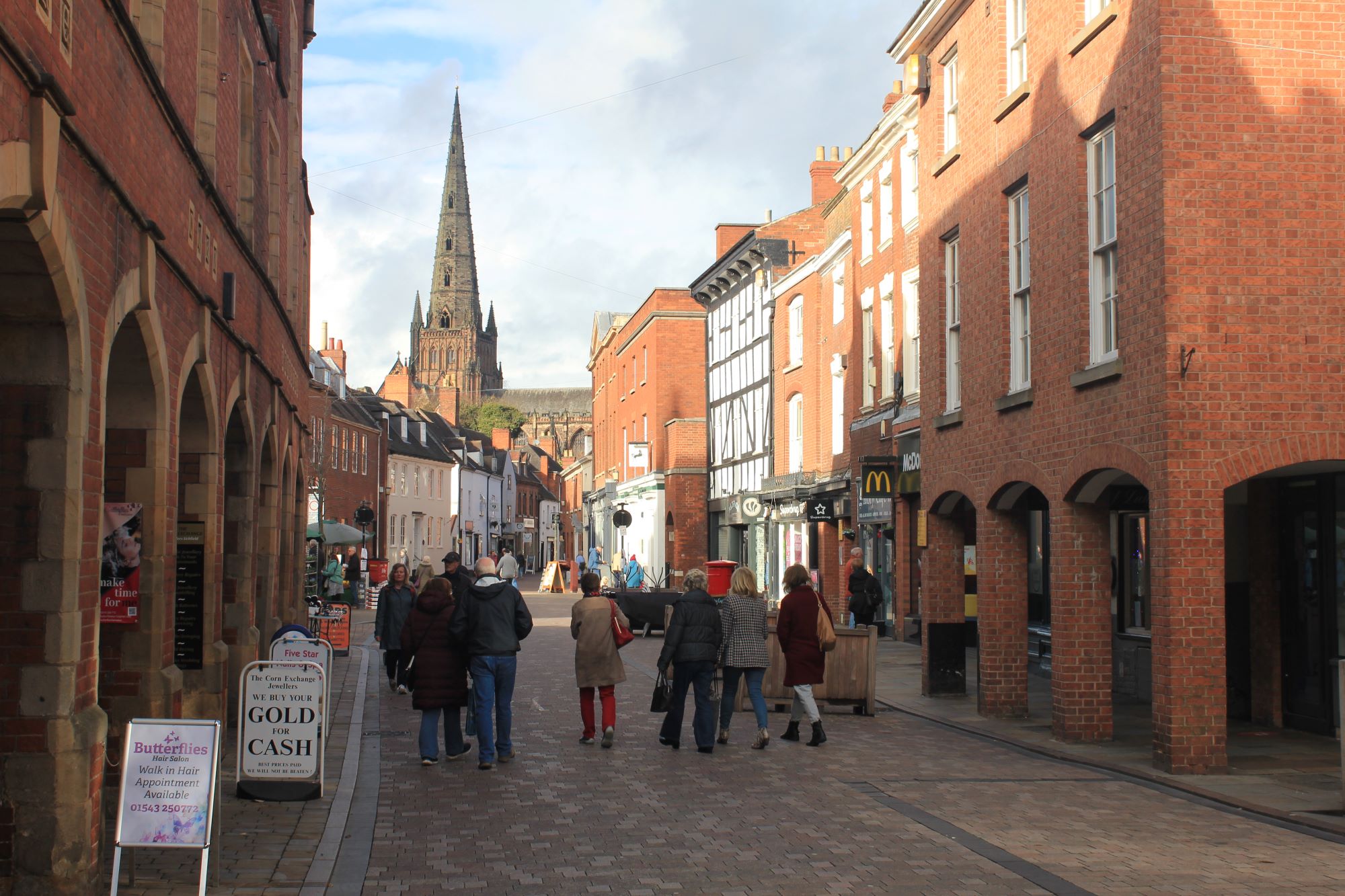 People walking in the pedestrianised area in Lichfield city centre.