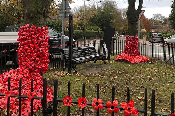 image of the park with poppies and cut outs of soldiers