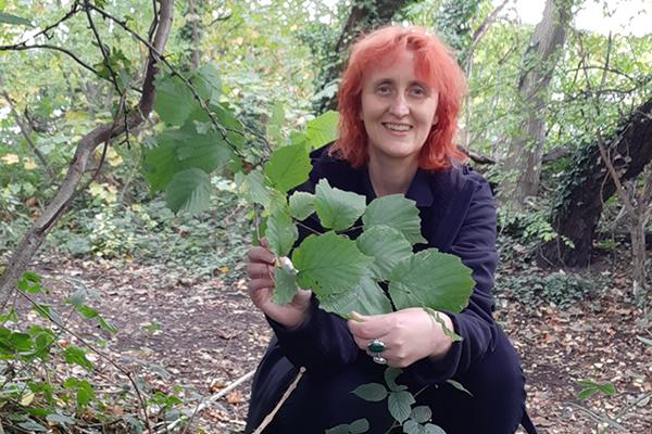 Ruth in woodland holding leaves