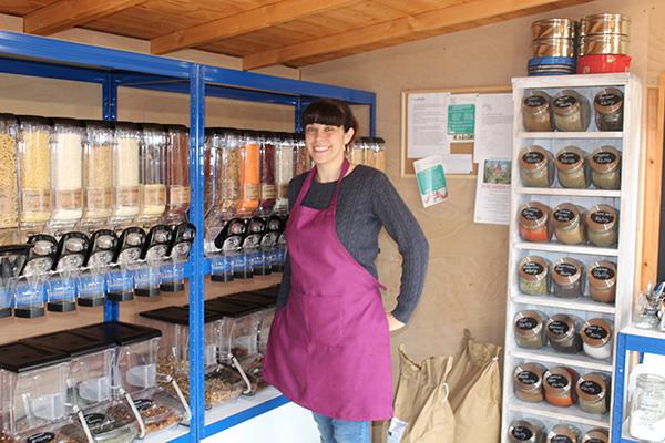 Image of woman next to dry food dispensers