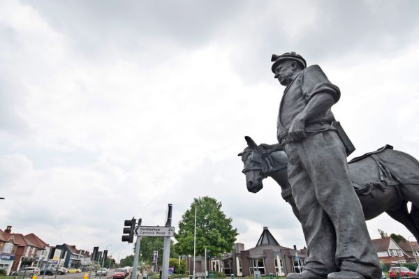 A picture of the miner statue at Sankey's Corner.