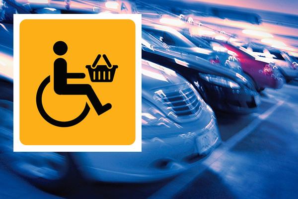 cars parked in car park with shopmobility logo over the top of the image