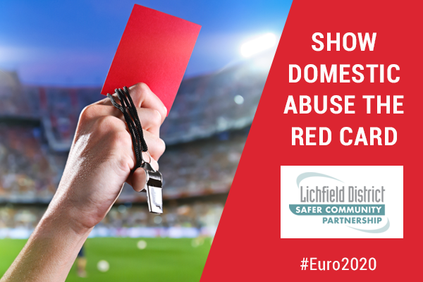 referee hand holding red card with wording: show domestic abuse the red card