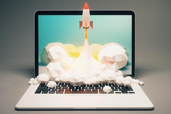 image of laptop with rocket taking off on the screen