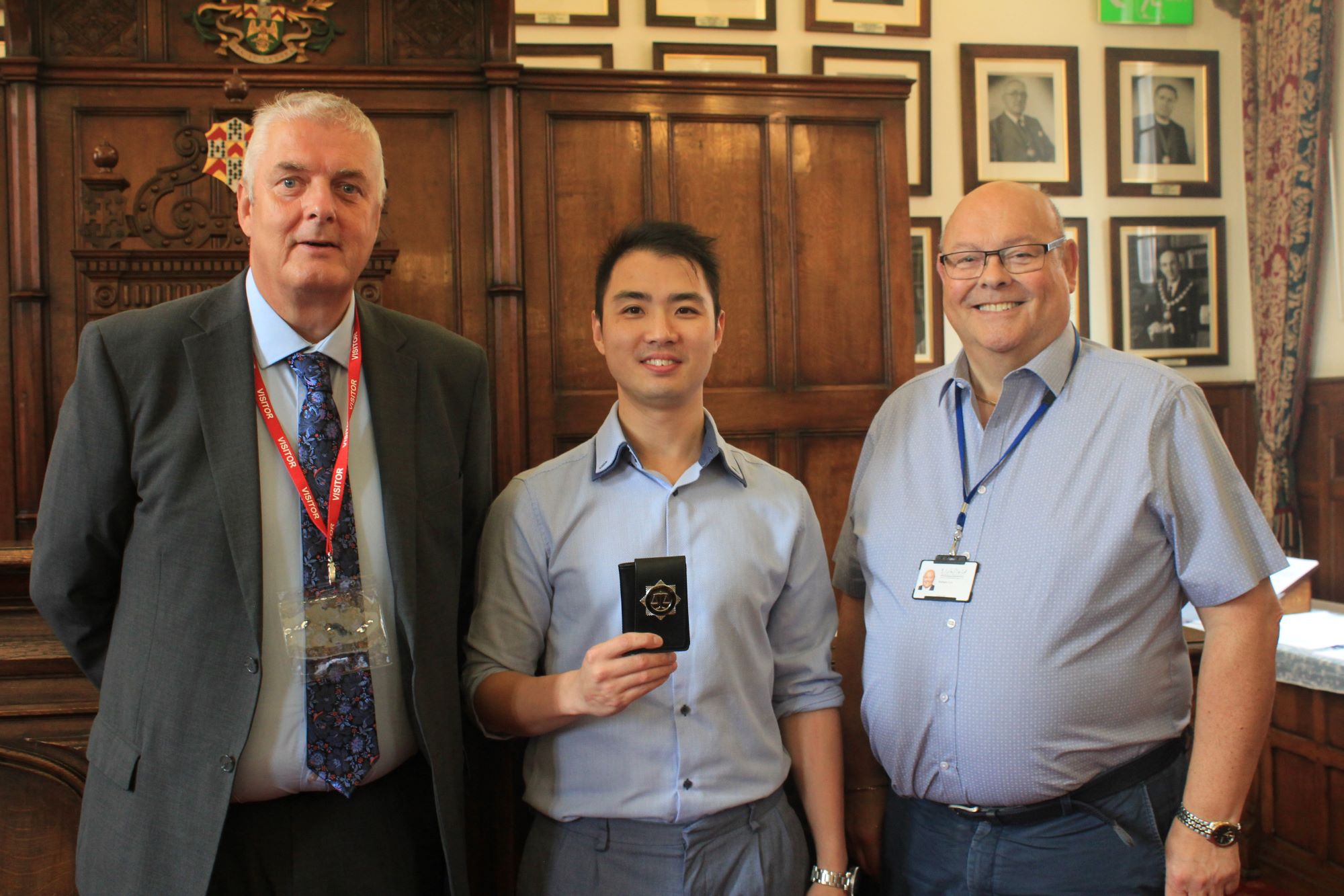 Lichfield District Council Environmental Protection Officer Chung Tse receives his warrant card.