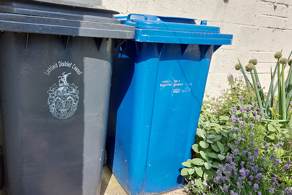 Black and blue wheelie bins