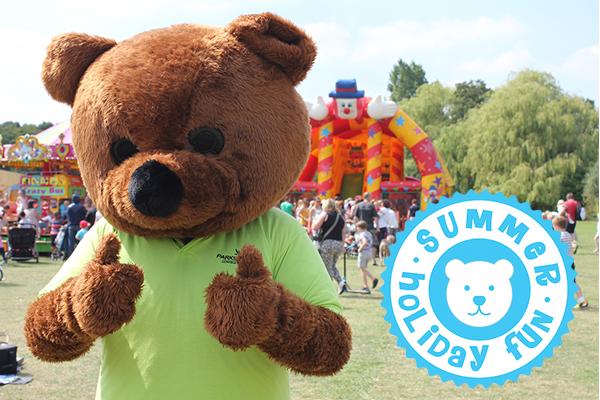 person in teddy bear costume doing a thumbs up