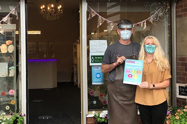 Kevin and Helen Lewis outside shop