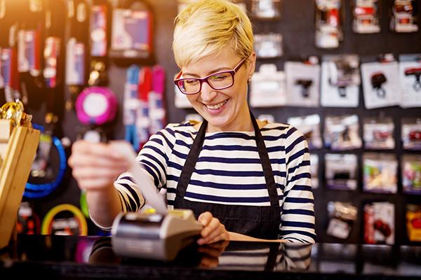 Shop keeper checking receipt
