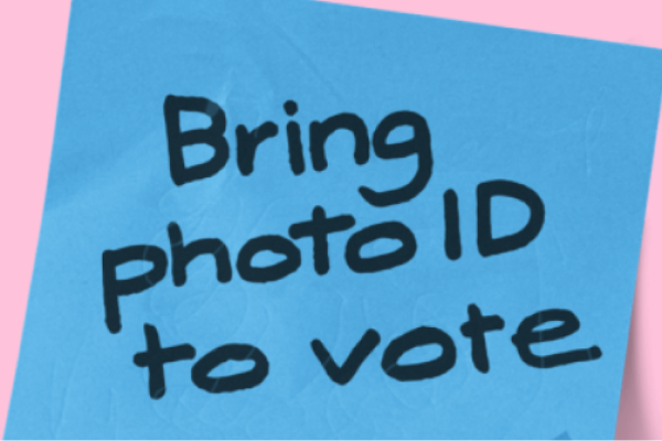Blue post it notes with the text Bring photo ID to vote