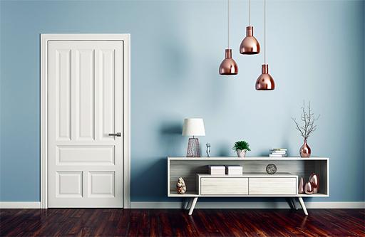 Hallway with door, pendant lights and display cabinet